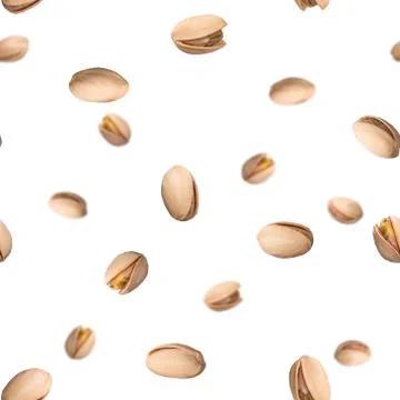 Seamless pattern with falling pistachio nuts isolated on white background Foto stock