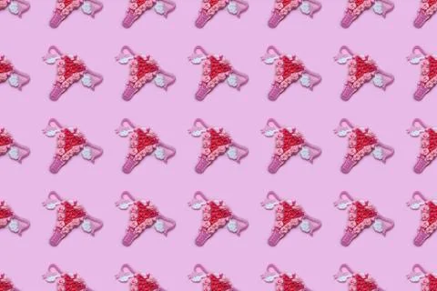Seamless pattern of female reproductive system, uterus, ovaries, pink backgro Stock Illustration
