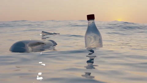 Seamless pattern of floating plastic bottles in the sea or ocean. Pollution Stock Footage 234596558