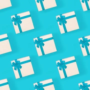 Seamless pattern in the form of a blue background with gift boxes. Background Stock Photos