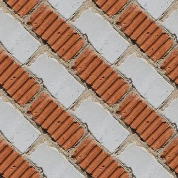 Seamless pattern of fragment of red and white stone wall Stock Photos