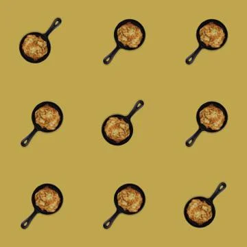 Seamless pattern of fried potato pancakes in a pan. Delicious food. Stock Photos