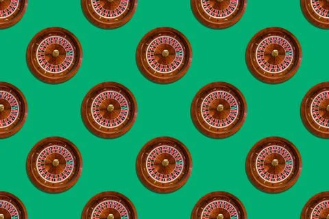 Seamless pattern of game table roulette from elite casino on green background Stock Photos