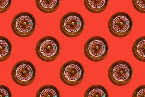 Seamless pattern of game table roulette from elite casino on red background Stock Photos