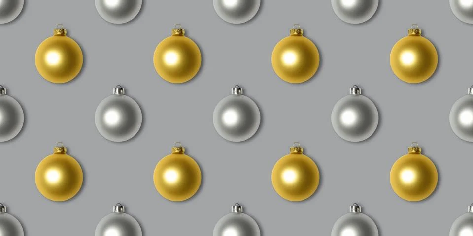 Seamless pattern with gold and silver Christmas decorations on a gray  Stock Photos