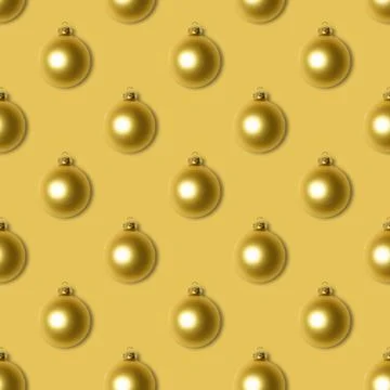 Seamless pattern with golden Christmas balls on yellow background.  Stock Photos