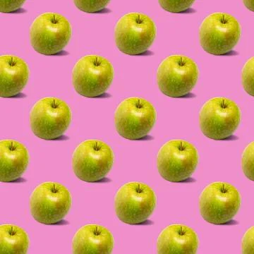 Seamless pattern with green apples on a pink background Stock Photos