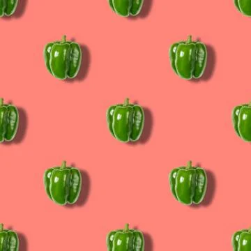 Seamless pattern with green pepper on pink background. Vegetable pattern. Stock Photos