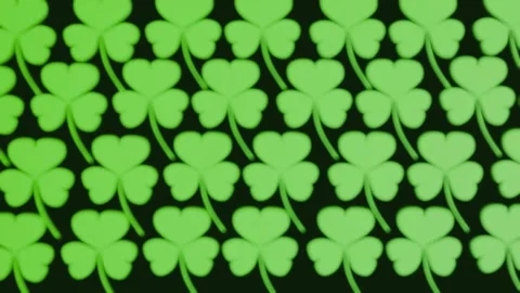 A seamless pattern of green three-leaf clovers or shamrocks Stock Footage 329811543