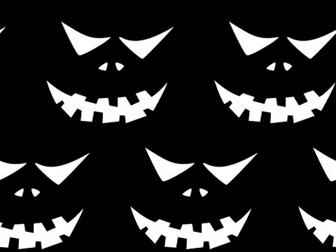 Seamless pattern with halloween carved jack faces silhouettes on black backgr イラスト素材