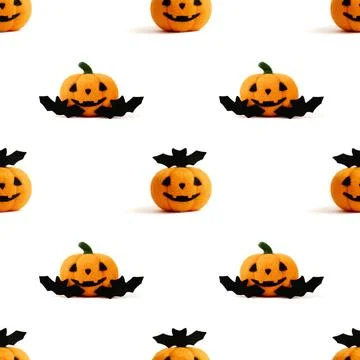 Seamless pattern with Halloween wool toy pumpkin and bats on a white Stock Photos