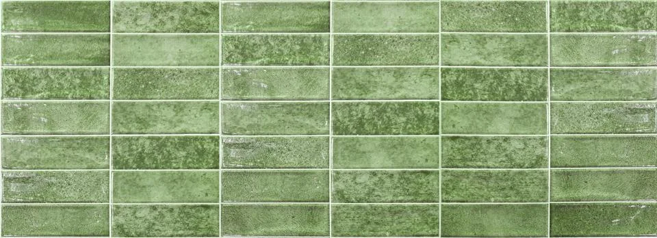 Seamless pattern of horizontal green glazed ceramic tiles. Vibrant brick text Stock Photos