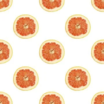 Seamless pattern of isolated slices of grapefruit. Wallpaper for background Stock Photos