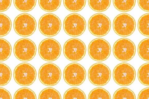 Seamless pattern of isolated slices of orange. Wallpaper for background, design Stock Photos