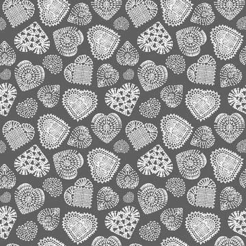 Seamless pattern of knitted hearts for valentine's day on gray background Stock Illustration