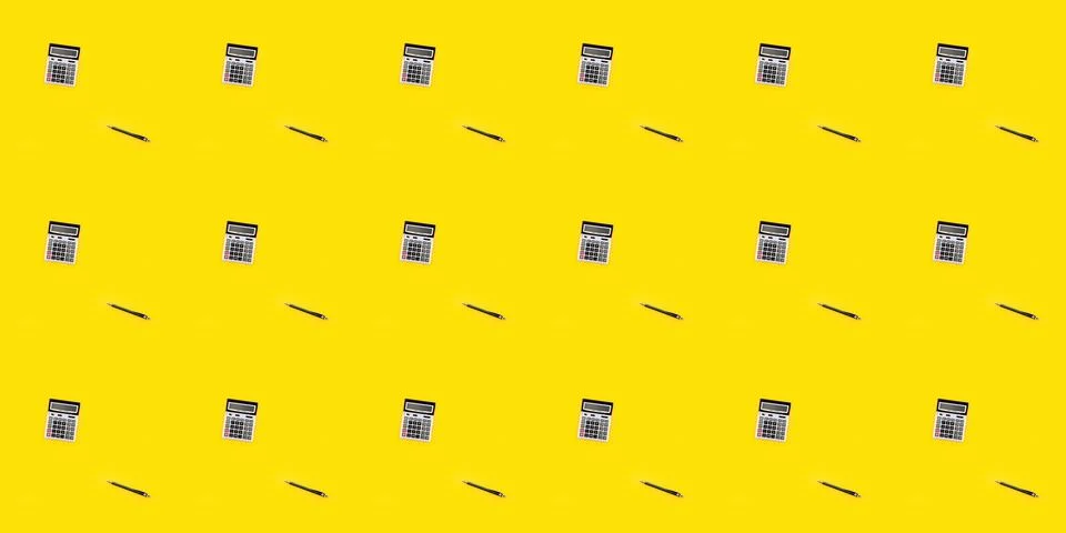 Seamless pattern with a large calculator and pen on yellow background. Financial Stock Photos