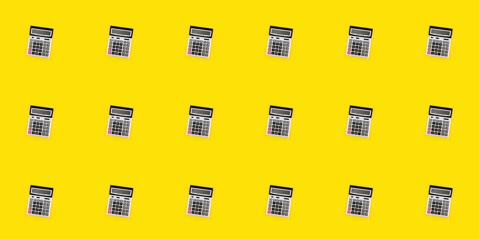 Seamless pattern with a large silver calculators on yellow background. Financ Stock Photos