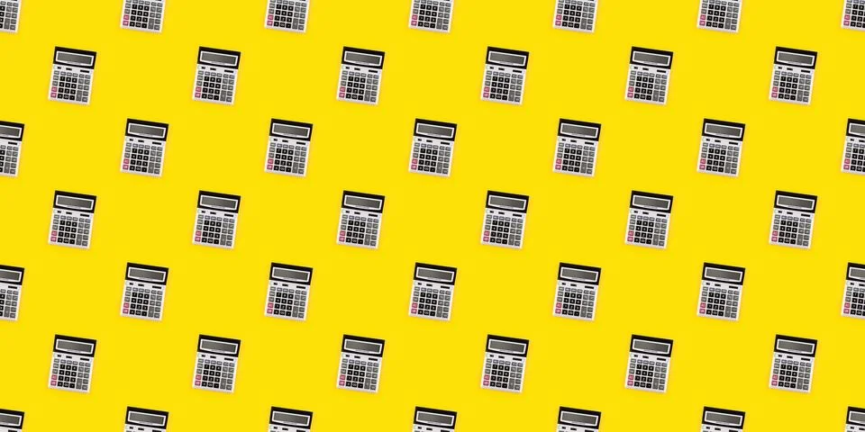 Seamless pattern with a large silver calculators on yellow background. Finance Stock Photos
