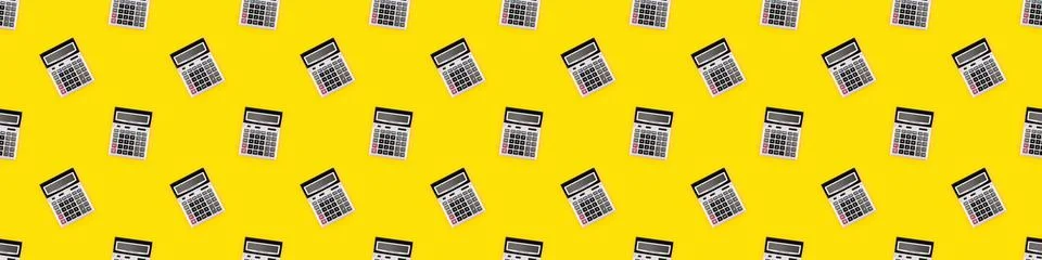 Seamless pattern with a large silver calculators on yellow background. Financial Stock Photos
