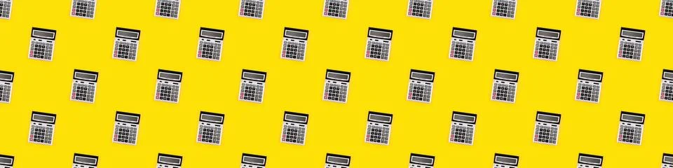 Seamless pattern with a large silver calculators on yellow background. Financial Stock Photos