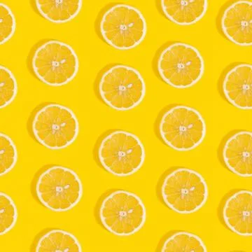 Seamless pattern of lemon on yellow background Stock Photos
