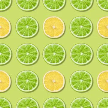 Seamless pattern with lime and lemon on a green background.  Stock Photos