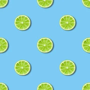 Seamless pattern with lime on blue background. Tropical abstract background. Stock Photos