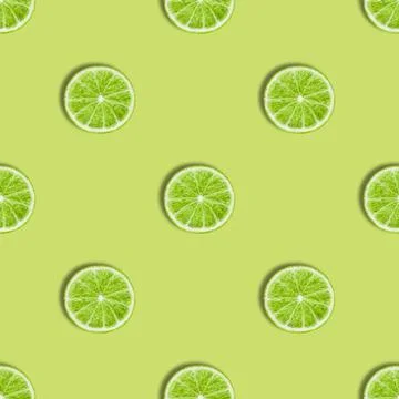 Seamless pattern with lime on a green background Stock Photos