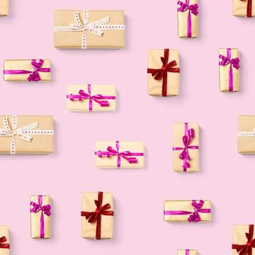 Seamless pattern made from gift boxes on pink background presents, gifts minimal Stock Photos
