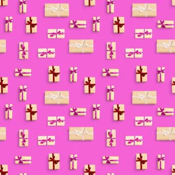Seamless pattern made from gift boxes on pink background presents, gifts minimal Stock Photos