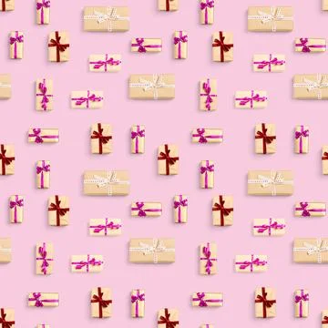 Seamless pattern made from gift boxes on pink background presents, gifts minimal Stock Photos