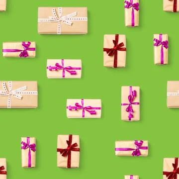Seamless pattern made from gift boxes on green background presents, gifts Stock Photos