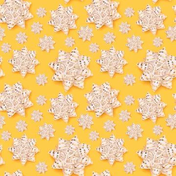 Seamless pattern made of golden ribbon bows. Stock Photos