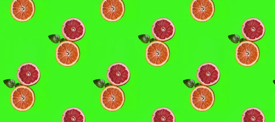 Seamless Pattern made with pieces of orange fruit on green color background. Stock Illustration