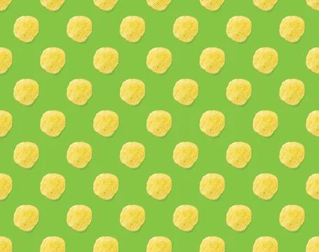Seamless pattern made from Potato chips on green background flat lay. potato Stock Photos