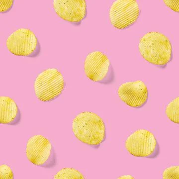 Seamless pattern made from Potato chips on pink background flat lay. potato Stock Photos