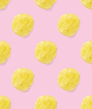 Seamless pattern made from Potato chips on pink background flat lay. potato Stock Photos