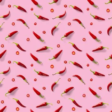 Seamless pattern made of red chili or chilli on pink background. Minimal food Stock Photos