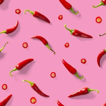 Seamless pattern made of red chili or chilli on pink background. Minimal food Stock Photos