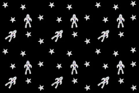 Seamless pattern made of silver astronauts and stars on black Stock Photos
