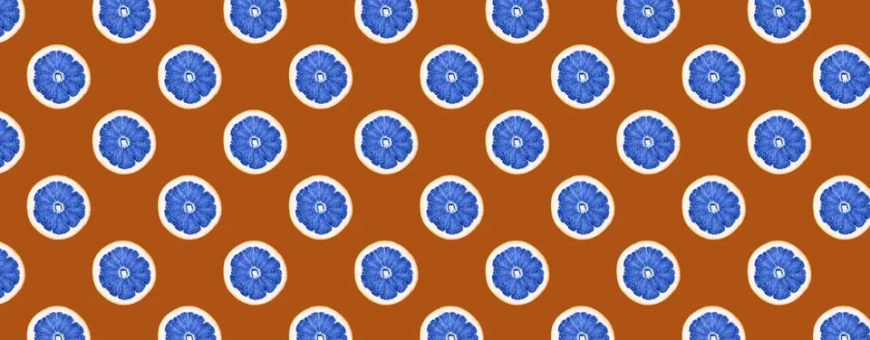 Seamless Pattern made with slices of lemon fruit toned in blue on brown backg Stock Illustration
