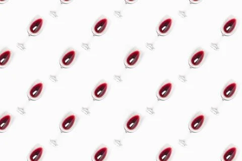 Seamless pattern made of wine glasses filled with red wine Stock Photos