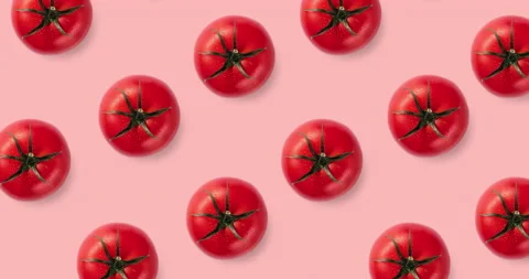 Seamless pattern with many red tomatoes isolated on a pink background Stock Footage 134573021