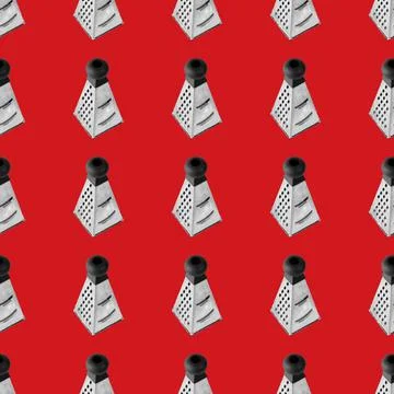Seamless pattern from Metal grater. Isolated on red background flat lay. Stock Photos