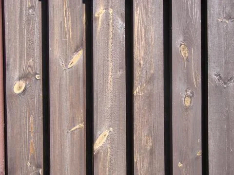 Seamless pattern of modern wall covering with vertical wooden slats for backg Stock Photos