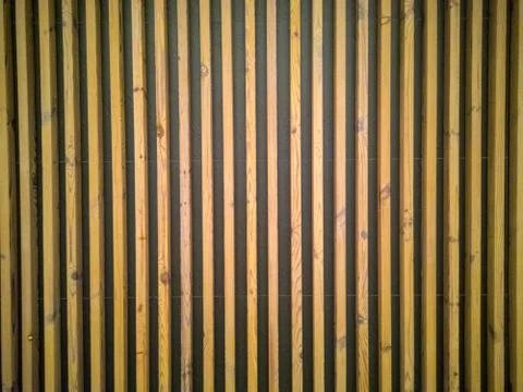 Seamless pattern of modern wall paneling with vertical wooden slats for backg Stock Photos