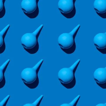 A seamless pattern of multiple blue medical enema. Stock Photos