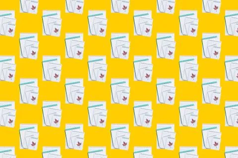Seamless pattern with notepads on a yellow background. 스톡 사진