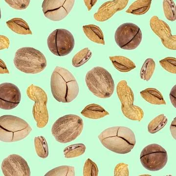 Seamless pattern of nuts close-up on a light green background, top view, flat Stock Photos