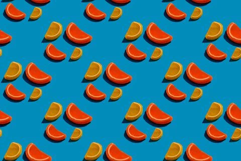 Seamless pattern of orange and lemon drops  on teal background Stock Photos